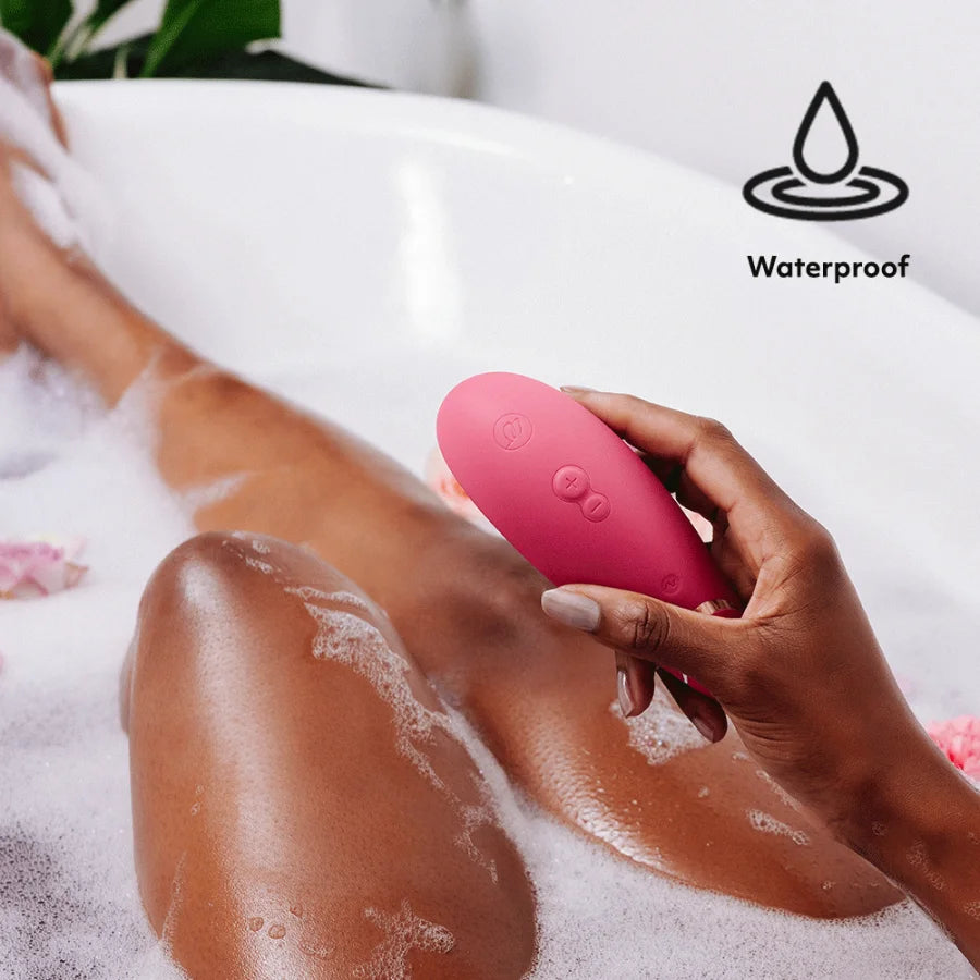 Women Using waterproof Womanizer Premium 2 Air Pulse Clitoral Vibrator - Raspberry while bathing